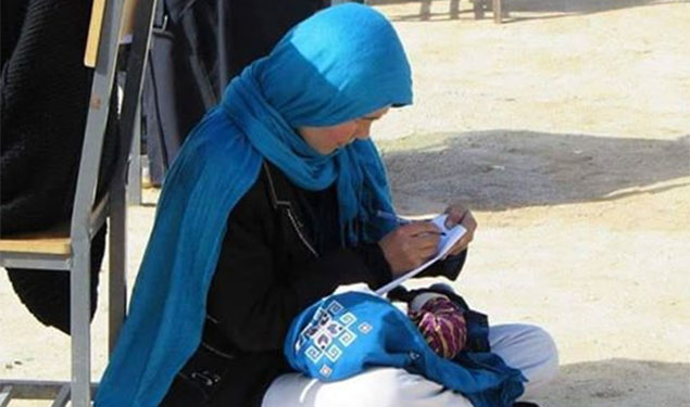 Afghan Woman Writing Exam